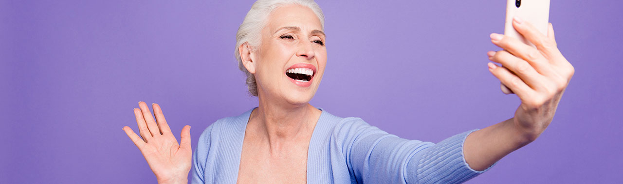 Elderly woman taking a selfie