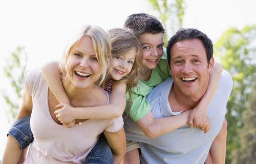 Family of four having fun outdoors