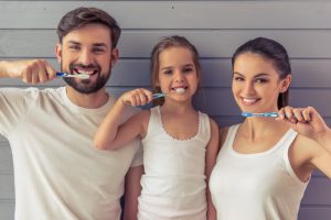 family brushing their teeth