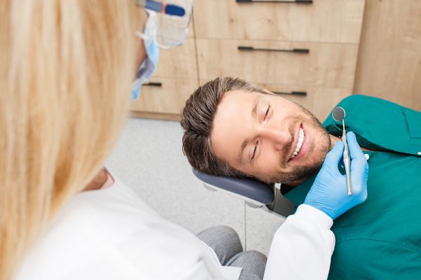 young man getting a dental exam